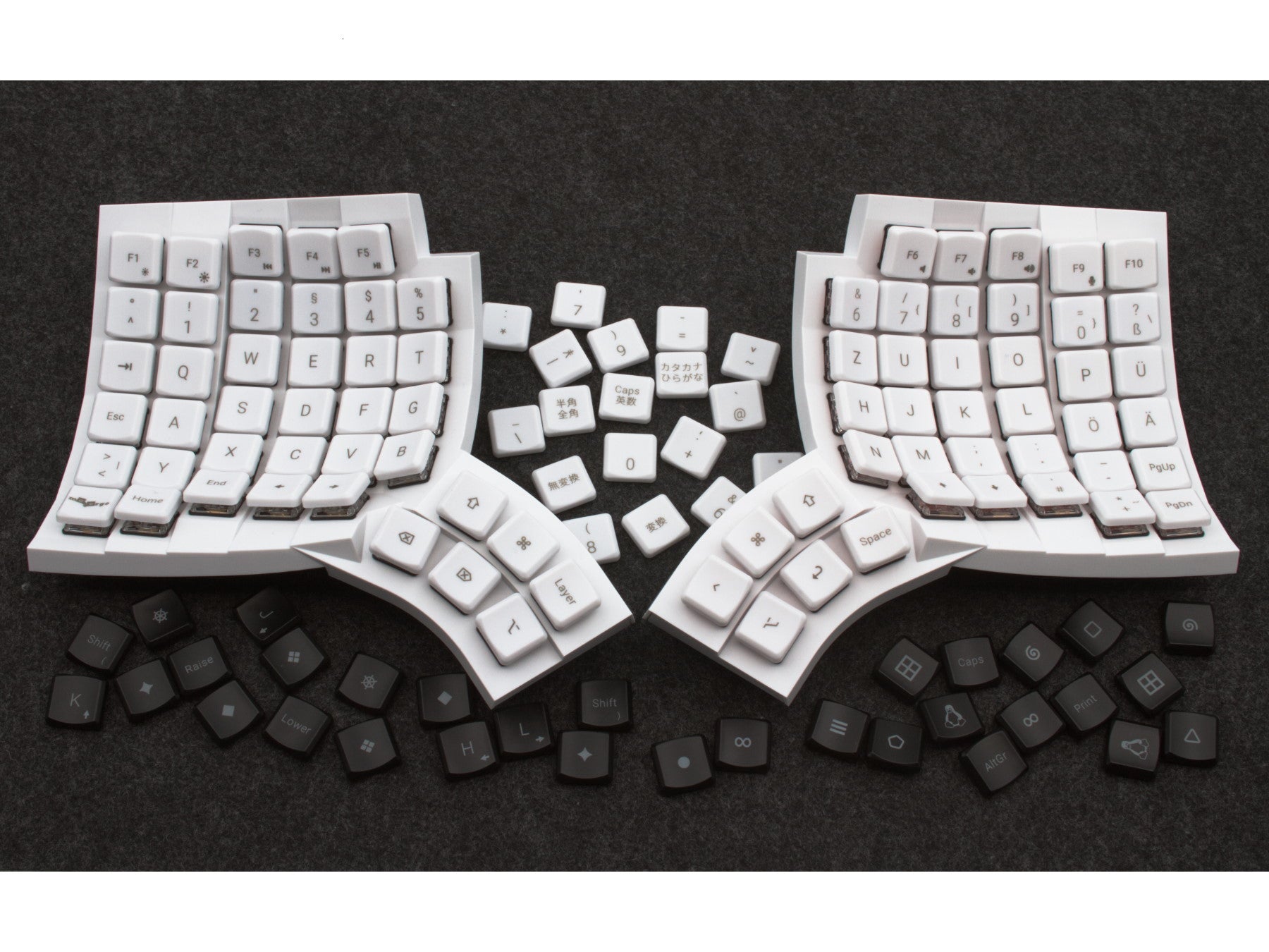 Custom designed POM keycaps for low-profile mechanical keyboard spread out on table 